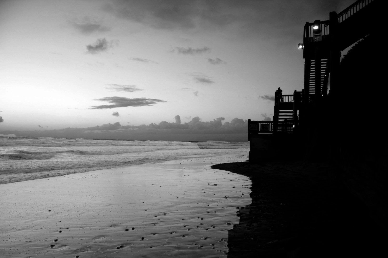 Coastal view with expansive ocean and rugged cliffs under a clear sky