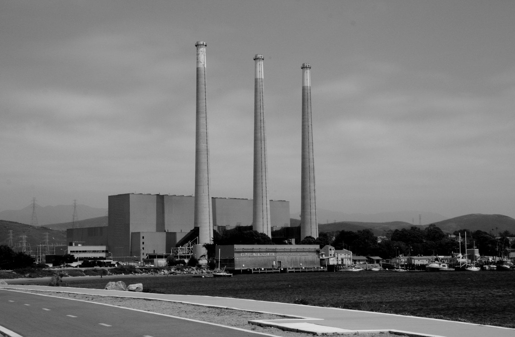 Serene coastal scene at Morro Bay featuring the iconic Morro Rock at sunset